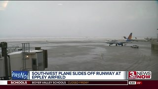 Plane slides off runway at Eppley Airfield