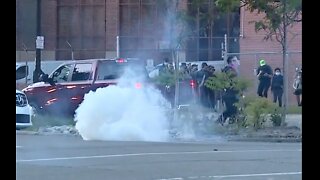 Protesters clash with Detroit police as curfew goes into effect Sunday night