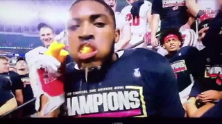 Wisconsin Badger Devours An Orange After Beating Miami
