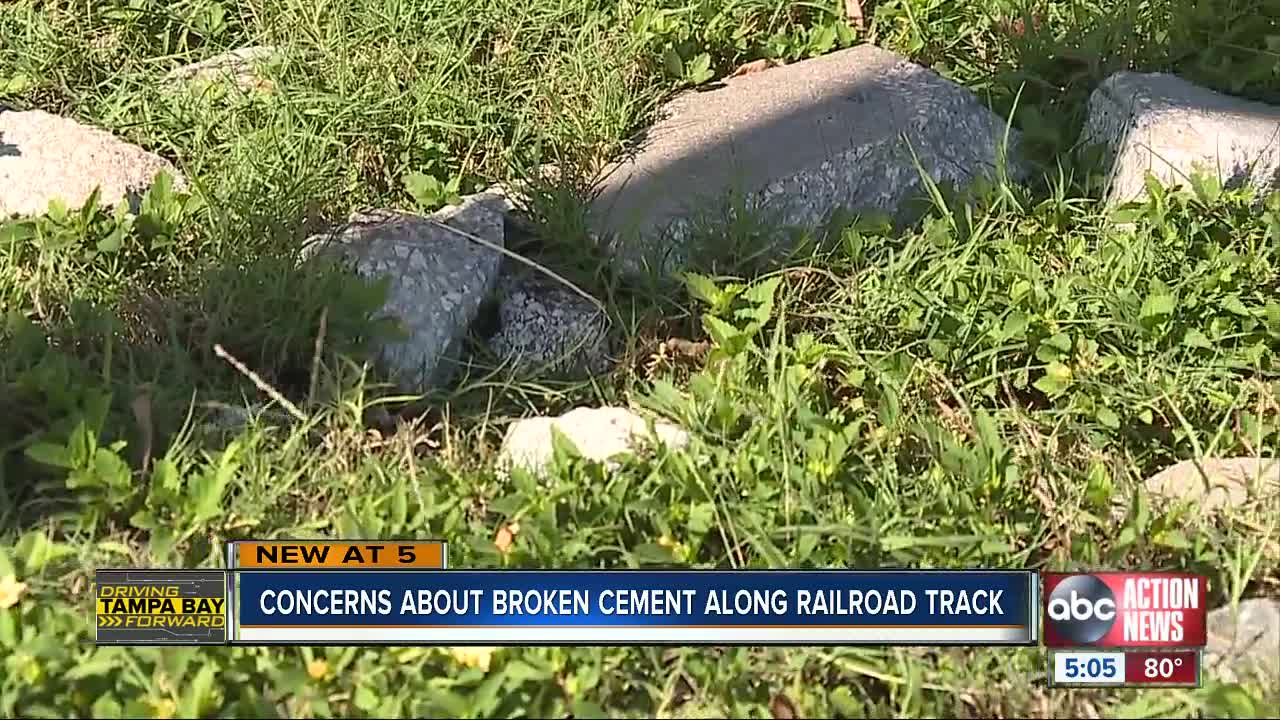 Concerns about broken cement along railroad track