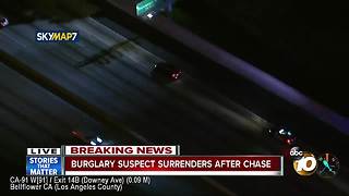 Burglary suspect surrenders after chase