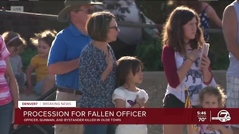 People line Arvada streets in procession for fallen Arvada police officer