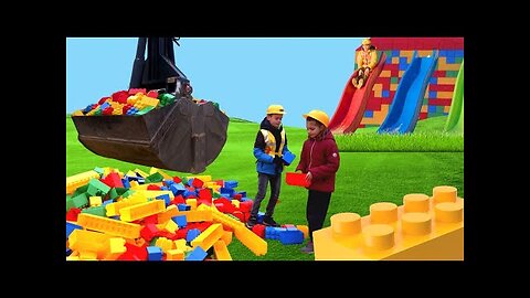 The kids build a Lego tower with a real construction vehicle 🚧👷‍♀👷‍♂