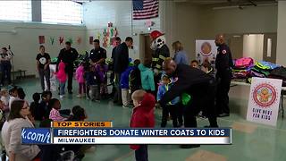 firefighters donate winter coats to kids
