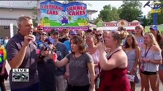 Brian Gotter tries ants at the State Fair