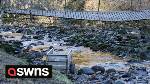 A man has died after a vehicle and trailer fell into river when a bridge collapsed.