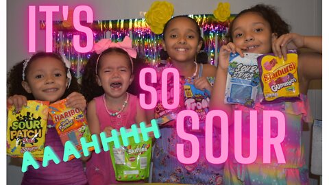 Watch D Little Sisters doing a sour candy challenge for the first time.