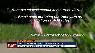 HOA orders homeowner to take down American flags from yard