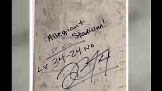 Derek Carr signs Allegiant Stadium following Raiders win