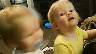 Twin babies love rocking out to heavy metal!