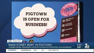 Main Street Mart in Pigtown says "We're Open Baltimore!"