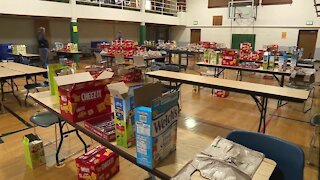 College student pack snacks for Green Bay area schools