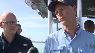 Governor Scott talks to media after tour of algae in the Caloosahatchee