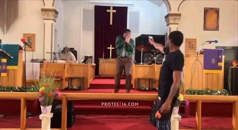 Church Pastor almost gets Shot by Gunman but Gun Jams up inside Church