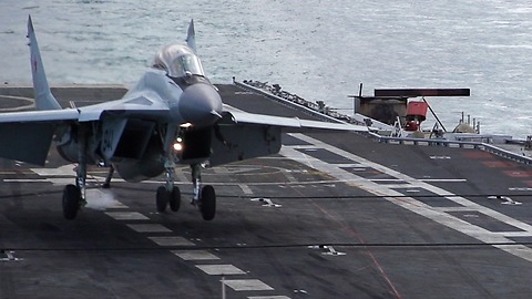 Slow Motion Footage Captures Jet Fighter Landing On Aircraft Carrier