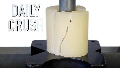 Crushing a candle with hydraulic press