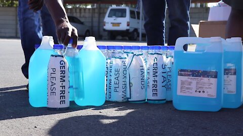 South Africa - Cape Town - Ward Councillor Sonwabile Ngxumza donating hand sanitizers (bAn)