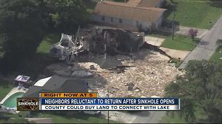 Neighbors reluctant to return after sinkhole opens