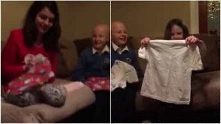 Watch this creative Christmas morning pregnancy announcement