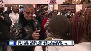 Detroit police surprise people by handing out cash from Secret Santa