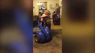 A Young Boy Gets Dizzy After Spinning On A Segway