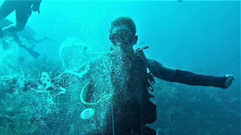 Scuba diver demonstrates impressive underwater bubble ring talent