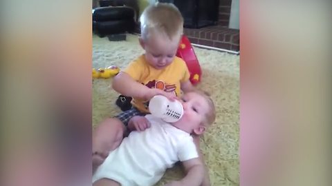 Tot Boy Loves To Bottle Feed His Baby Brother But Doesn’t Like Kissing Him