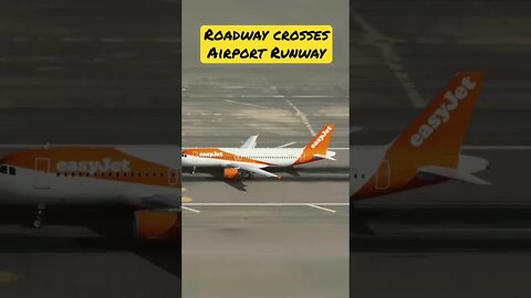 Roadway Crosses Runway; Plane takeoff Gibraltar