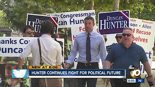 Hunter continues to fight one year after indictment
