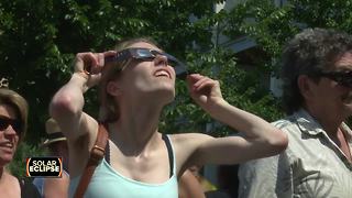 Hundreds gather at Green Bay's City Deck to witness solar eclipse