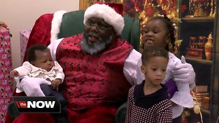 Diverse Santa Claus posing for pictures across Wisconsin