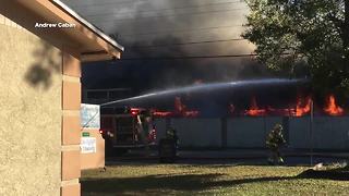 Firefighters battle two-alarm fire at town homes in Tampa