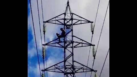 RISKING LIFE RISING INTO AN ENERGY TOWER