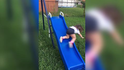 Little Girl Falls Off A Slide