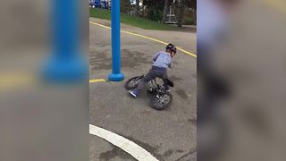 A Little Boy Crashes His Bike Into A Pole