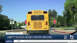 Empty San Diego Unified school buses driving around