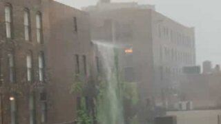Storm creates huge waterfall on building