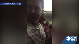 Woman surprises husband with pregnancy announcement on flight from Tampa