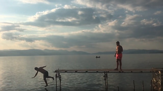 Epic fail: Guy falls off dock while jumping into lake