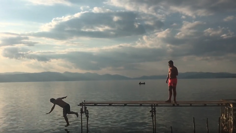 Epic fail: Guy falls off dock while jumping into lake