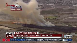 Several acres burning at Wetlands Park