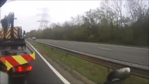 Recovery Truck Runs Motorcyclist Off the Road