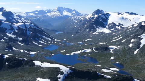 lake and mountain landscape in jotunheimen national park norway