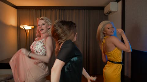 Ladies are enjoying dancing in a room