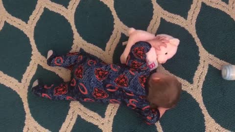 Adorable baby cuddles with her favorite bear!