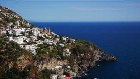 sea and city of positano along amalfi coast italy