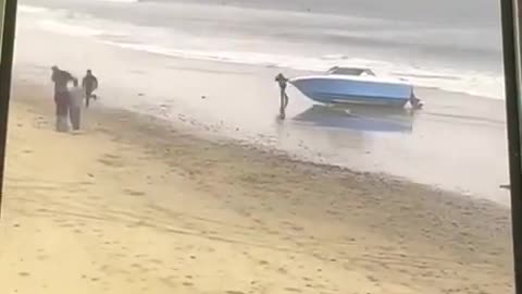 Carlsbad California - a Group of men Storm the Beach and Disperse Throughout the City