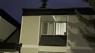 Airplane flies above homes