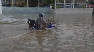 Motorcyclist Makes Valiant Attempt to Drive Through a Flood