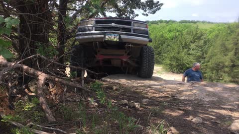 Silverado trying to find a lane up a ledge Tuttle ORV